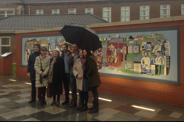 Michael Edmonds' family in front of his mural as it is unveilled at Llandough Hospital, 16 December 2015